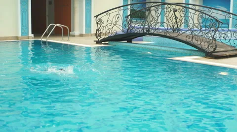 A boy swims in the pool Stock Footage 64312783