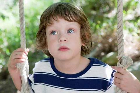 Boy on a swing Stock Photos
