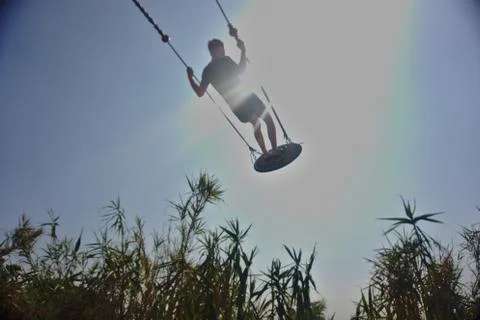 A boy on a swing Stock Photos