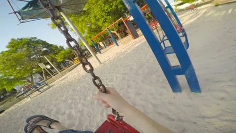 Boy on a swing in a playground - Point of View (POV) shot Vidéo 77969433