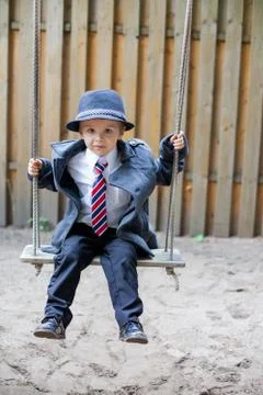 Boy on a swing, smiling Stock Photos