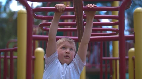 Boy Swinging on the Monkey Bars Stock Footage 91624857
