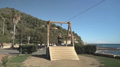 Boy Swinging on Pulley Stock Footage 83387917
