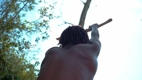 Boy swinging from a rope Stock Footage 323762740