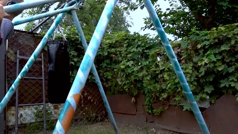 A boy swings on a swing in the backyard Stock Footage 207770159