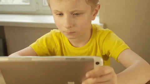 Boy with tablet computer, close view. Dolly shot Stock Footage 62466138