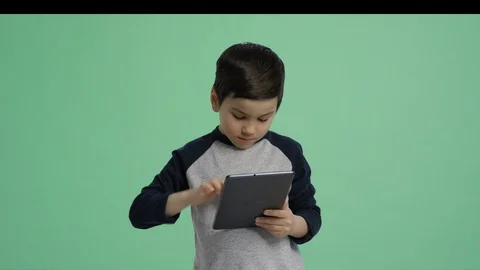 Boy with tablet - green screen alpha channel lifestyle boy isolated Stock Footage 128992057