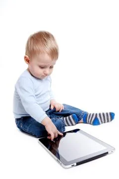 Boy with tablet Stock Photos