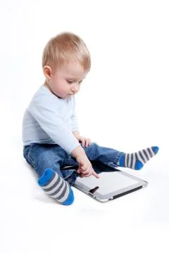 Boy with tablet Stock Photos