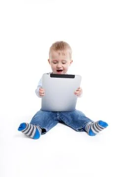 Boy with tablet Stock Photos