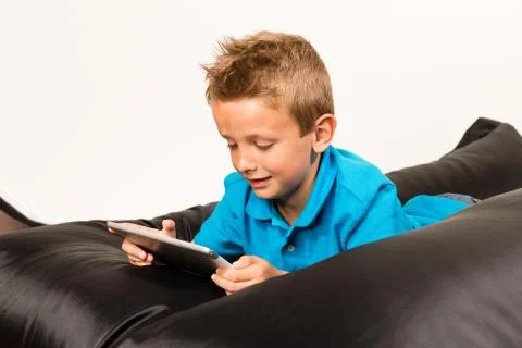 Boy with tablet Stock Photos