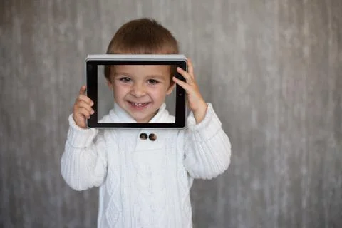 Boy with tablet Stock Photos