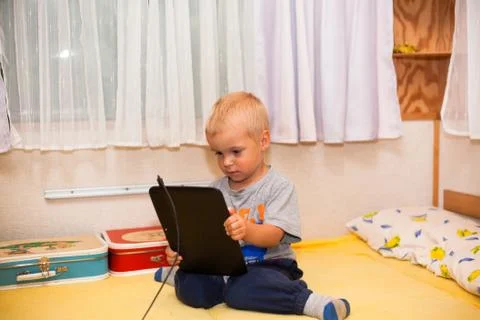 Boy with tablet Stock Photos