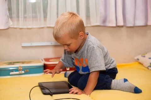 Boy with tablet Stock Photos