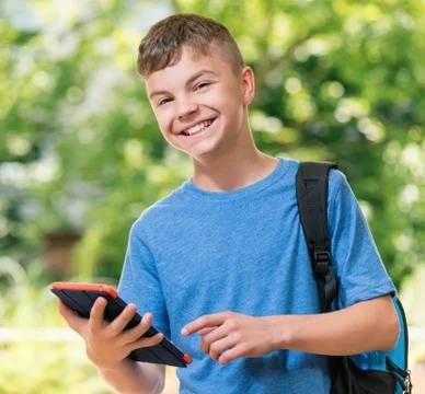 Boy with tablet Stock Photos