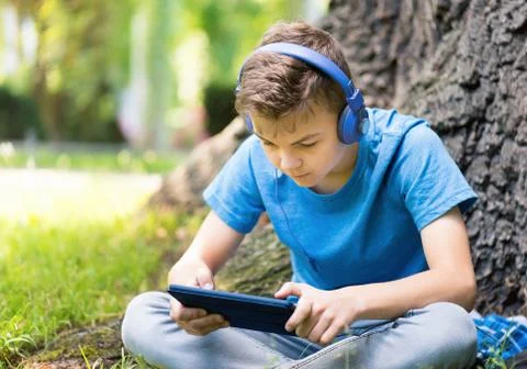Boy with tablet Stock Photos