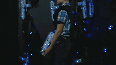 Boy takes aim at a lasertag weapon Stock Footage 77357060