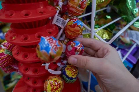 The boy takes a candy. Stock Photos