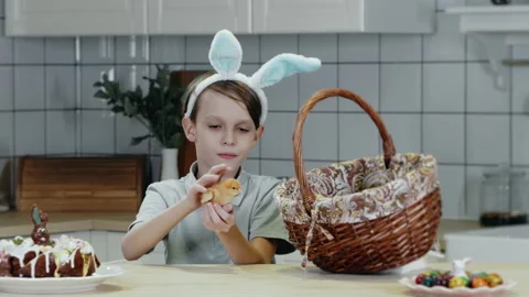 A boy takes an Easter newborn chick out of a basket. Stock Footage 303625519