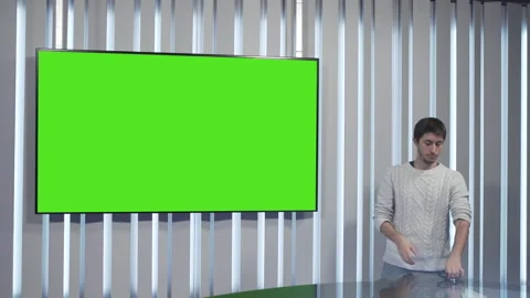 Boy takes off his glasses in front of the green screen Stock Footage 144246378