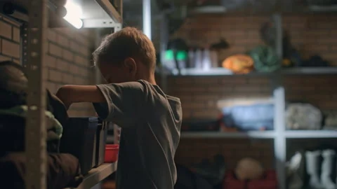 Boy takes instruments from tool box in garage. Child repairing machine mechanism Video stock 199485767