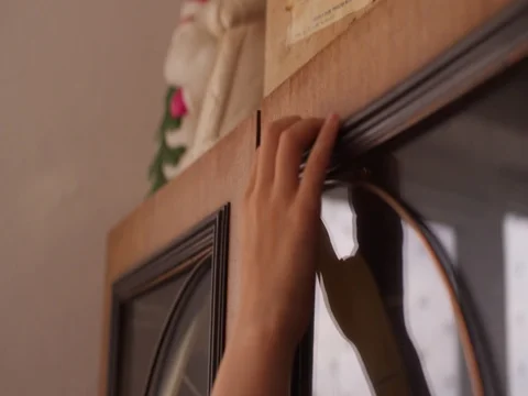 The boy takes an old box from the cupboard Stock-Footage 80499869