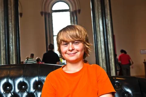 Boy takes a rest at a sofa Stock Photos