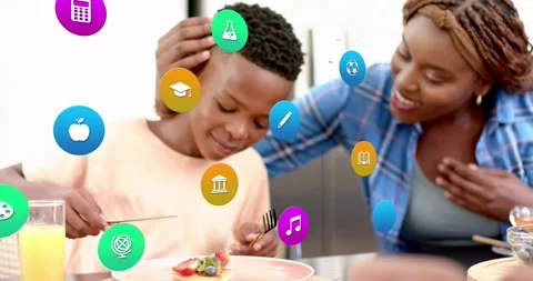 Boy taking bite as 3D education icons rising from pancake, mother offering Stock Footage 318917728