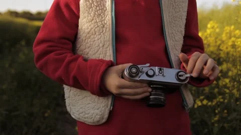 Boy taking photo on old camera Stock Footage 135320956