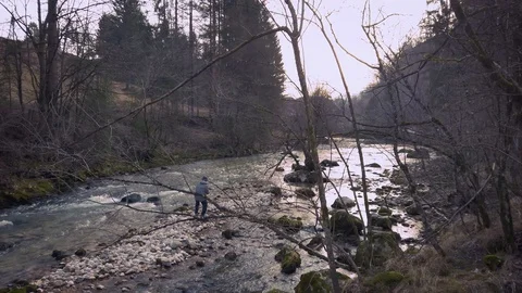 Boy taking a photo in the river Stock Footage 128254324