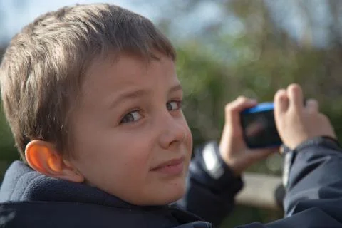 Boy taking picture Stock Photos