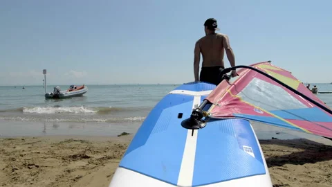 Boy Taking Windsurf On The Beach 스톡 동영상 235374553