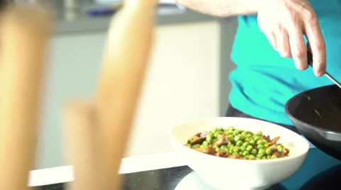 Boy talking to his father while dinner is prepared Stock Footage 63299676