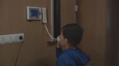 Boy talking on the intercom Stock Footage 46446312