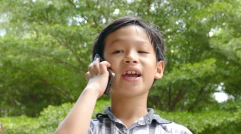 Boy talking on mobile phone Stock Footage 64108031