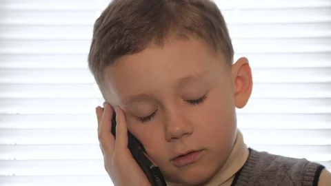 Boy talking on mobile phone Stock Footage 73570326