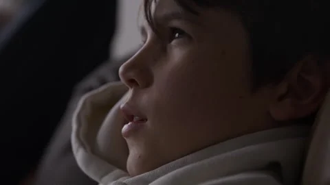 Boy talking to parent while focusing on playing video games - close up Stock Footage 316199277