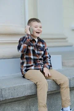 A boy talking on the phone Stock Photos