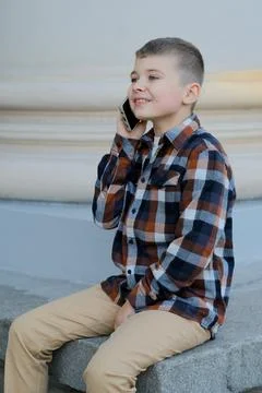 A boy talking on the phone 写真素材