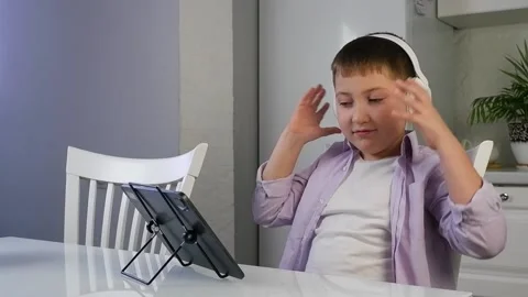 Boy is talking by video link Stock Footage 167910431