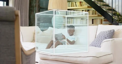 Boy tapping tablet screen, forming AR cube around him with code overlay and Stock Footage 318917745