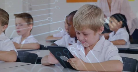 Boy tapping tablet, starting tech overlay and boosting classroom learning as Stock Footage 330355909