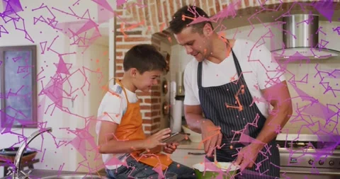 Boy tapping tablet steps and father stirring batter in green bowl while Stock Footage 320506355