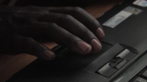 Boy taps n scroll on laptop Stock Footage 53089035