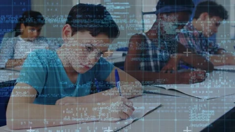 Boy in teal tee writing after teacher prompt, finishing classwork using blue Stock Footage 330192217