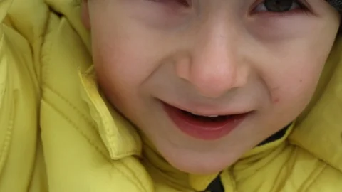 Boy is teasing and fooling on a camera. Close up. Boy is showing tongue Stock Footage 106716480