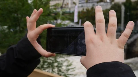 Boy testing phone camera Stock Footage 108820553