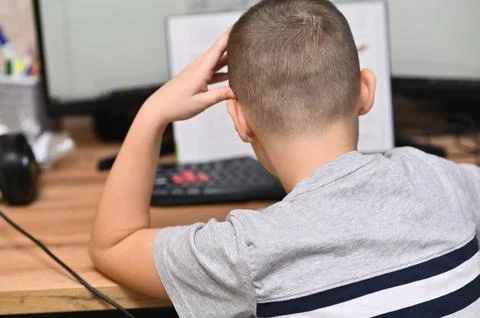 The boy is thinking about a book Stock Photos