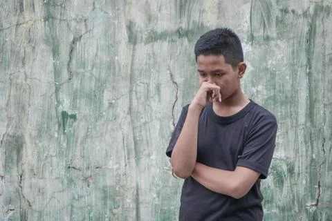 A boy is thinking about something Stock Photos