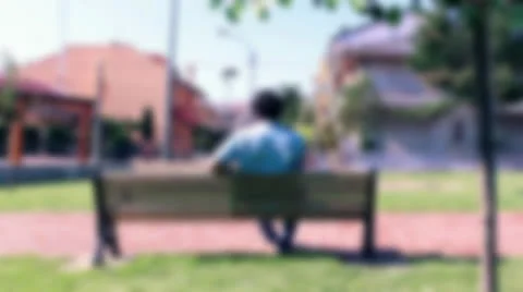 BOY THINKING ON THE BENCH 2 Stock Footage 25671971